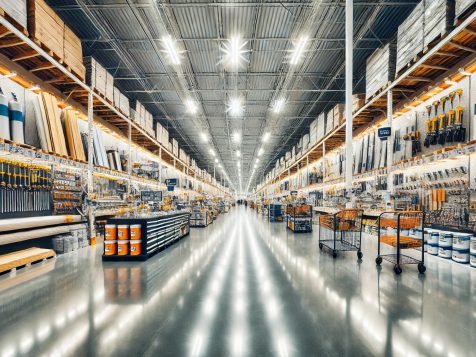 bright-home-improvement-store-high-resolution High-resolution photograph of a brightly lit home improvement store with wide aisles, neatly organized tools, lumber, paint cans, and hardware, creating a sharp and clean shopping environment.